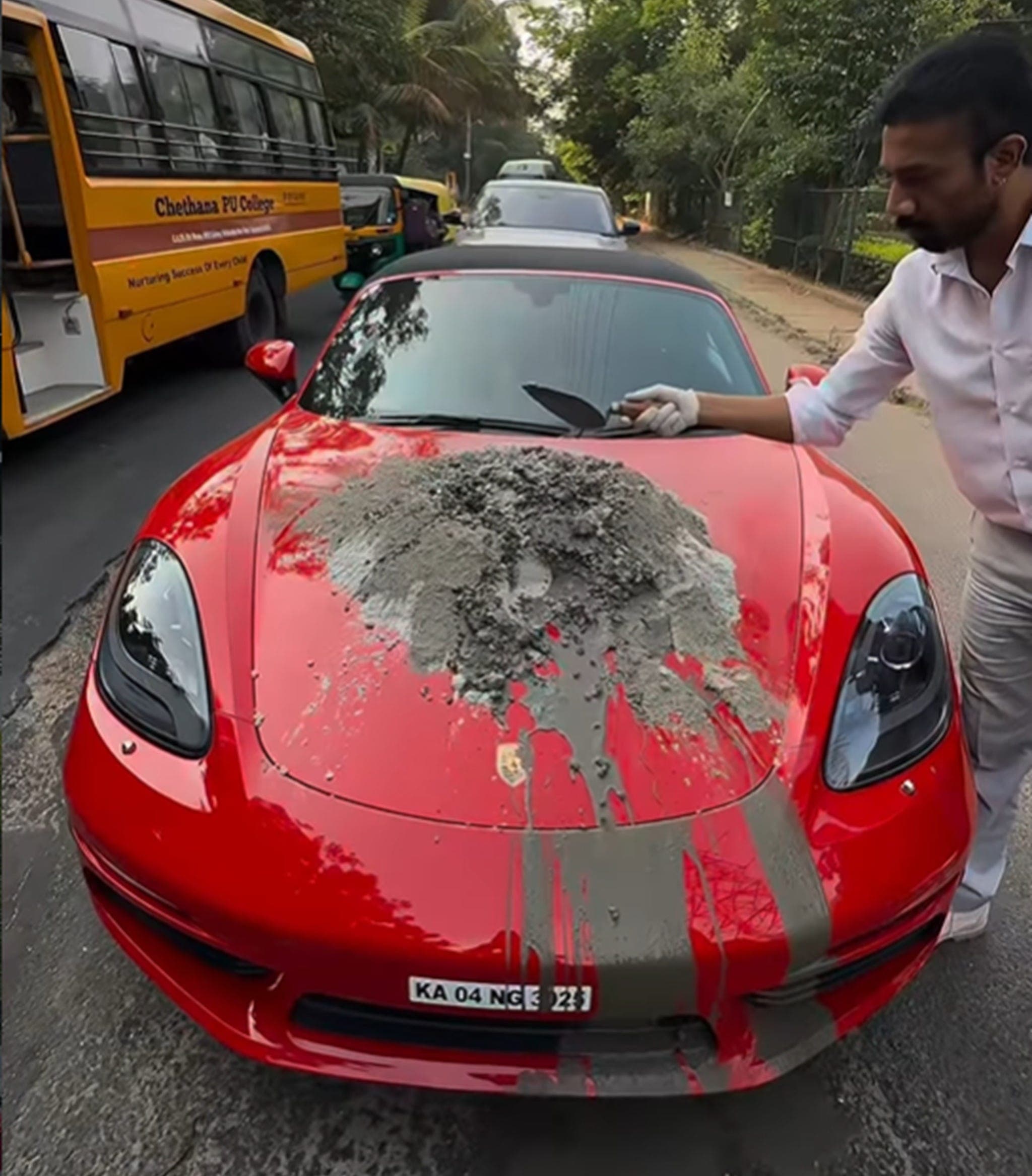 Man Mixes Concrete on Porsche Boxster's Hood to Fix Pothole, Showcase His Paint Protection Film