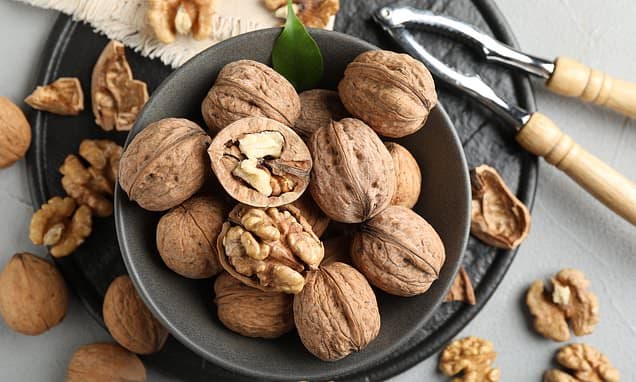 Can walnuts truly be crowned 'the healthiest nut'? How the brain-shaped kernels can lower cholesterol, help to protect against depression AND prevent mindless snacking