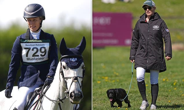 Zara Tindall walks a dog after getting back in the saddle to compete at international horse trials