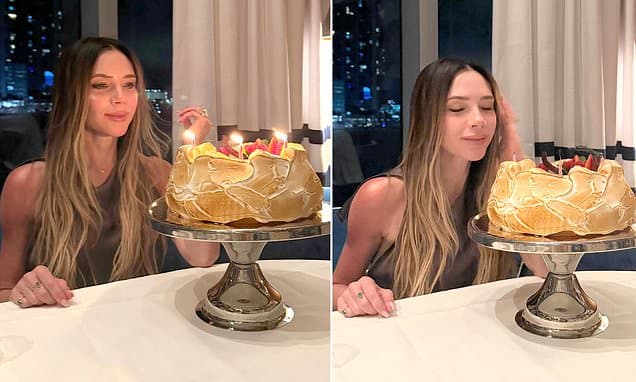 Birthday girl Victoria Beckham blows out her candles and says she is 'so grateful' to her family after 'magical' day - despite silence from Brooklyn