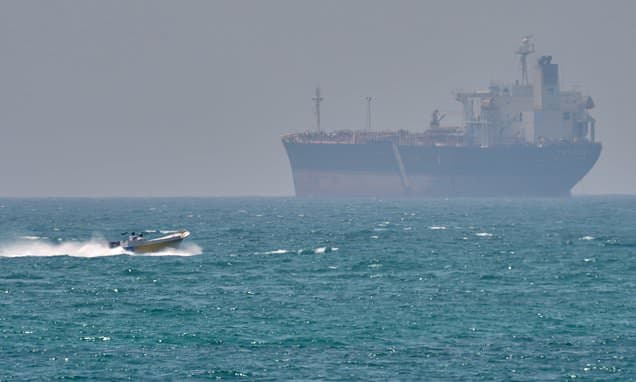 Iran warns ships approaching Strait of Hormuz to stay anchored or else they will be TARGETED - after firing on tankers and cruise ship: Live updates