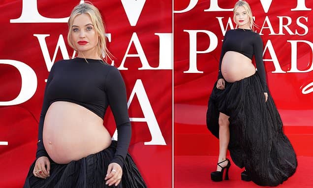Pregnant Laura Whitmore shows off her bare baby bump in a black crop top and skirt as she attends the Devil Wears Prada 2 premiere