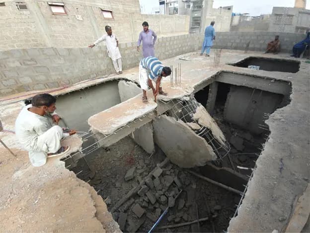 Illegal construction of extra floors, portions springs up with impunity in Karachi