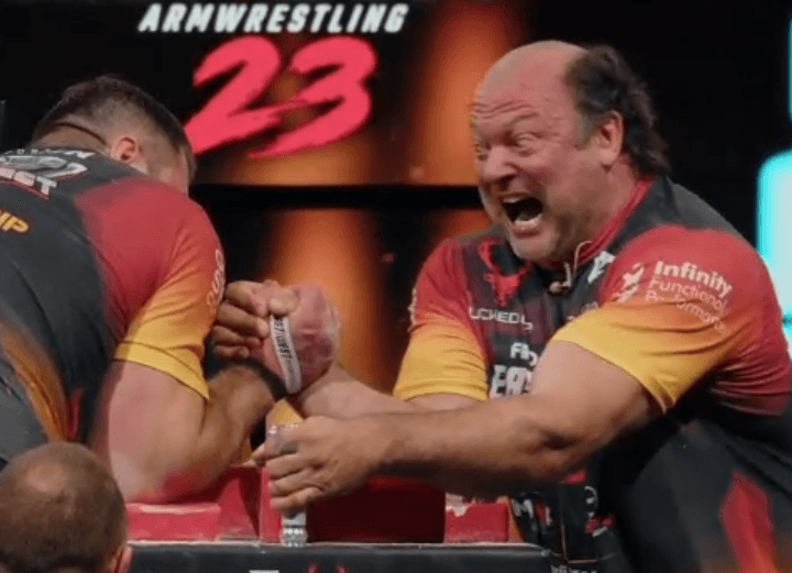 Oh Canada! Watch 50-year-old Devon Larratt crush Vitaly Laletin 4-1 in East vs. West 23 arm wrestling rematch