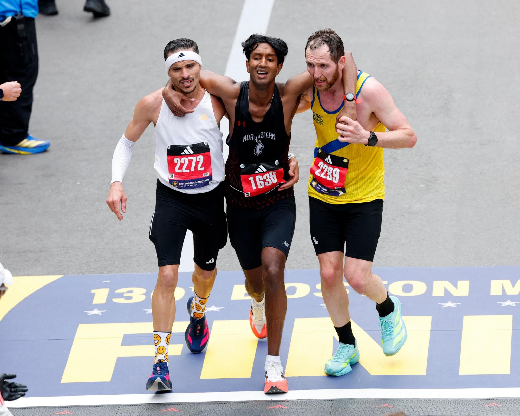 ‘Two are stronger than one’: Boston Marathon duo praised for helping struggling runner cross finish line